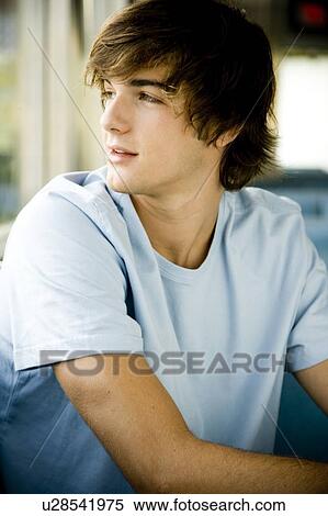 Portrait of a young man hanging out at a diner. View Large Photo Image Stock Photography - Portrait of a young man hanging out at a diner. . Fotosearch