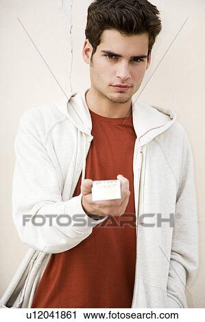 Portrait of a young man with cigarettes View Large Photo Image Stock Image - Portrait of a young man with cigarettes . Fotosearch