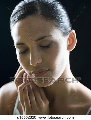 Stock Image - Portrait of a young woman. Fotosearch
