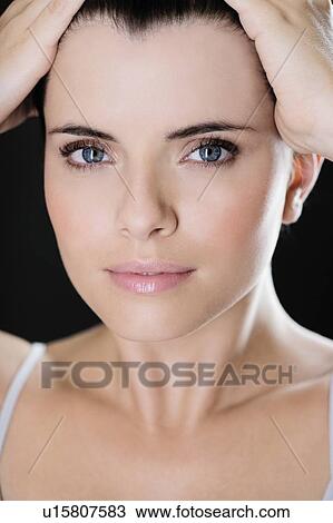 Portrait of a young woman's face View Large Photo Image Stock Image - Portrait of a young woman's face. Fotosearch