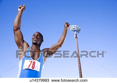 Portrait of an athlete with arm raised View Large Photo Image Stock Image - Portrait of an athlete with arm raised. Fotosearch