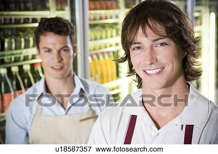 Stock Photo - Portrait of shop assistants in a supermarket. Fotosearch