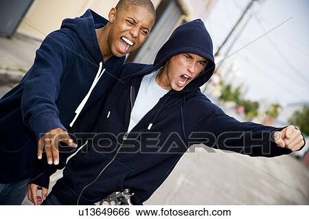 Portrait of two young street gang members View Large Photo Image Stock Photograph - Portrait of two young street gang members. Fotosearch