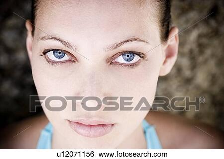 Stock Photograph - Portrait young woman's face. Fotosearch