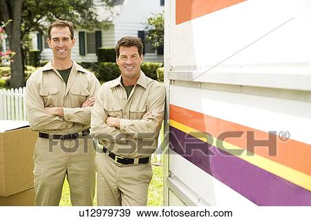 Removal men standing beside their van with packing boxes View Large Photo Image Stock Photo - Removal men standing beside their van with packing boxes. Fotosearch