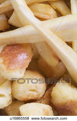 Roast potatoes and parsnips View Large Photo Image Stock Photo - Roast potatoes and parsnips. Fotosearch