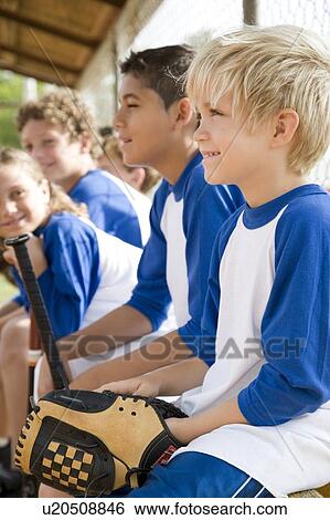 Stock Photograph - Side view little league baseball team. Fotosearch