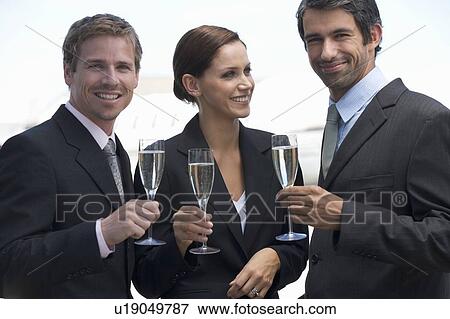 Three business colleagues drinking champagne View Large Photo Image Stock Photo - Three business colleagues drinking champagne. Fotosearch