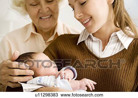 Stock Image - Three generations of a family. Fotosearch
