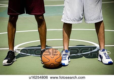 Two African American standing side by side on an urban basketball court, close up View Large Photo Image Stock Photograph - Two African American standing side by side on an urban basketball court, close up. Fotosearch