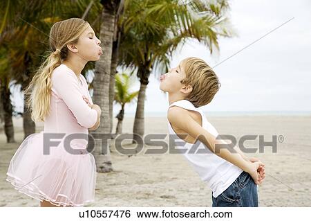 Two children on a beach View Large Photo Image Stock Photograph - Two children on a beach. Fotosearch