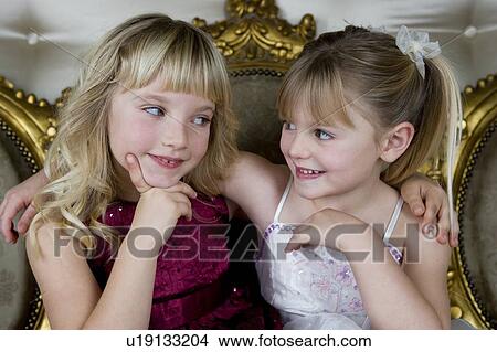 Picture - Two friends in party dresses . Fotosearch