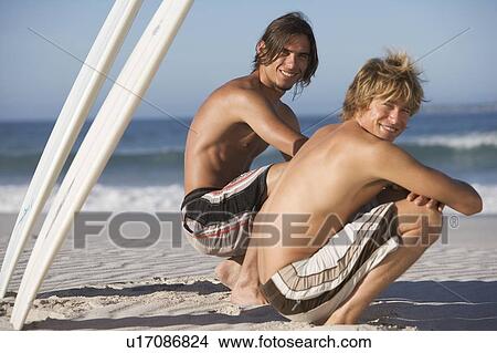 Picture - Two surfers. Fotosearch