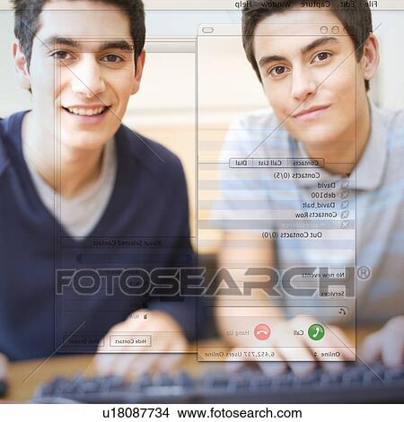 Two teenage boys using a computer View Large Photo Image Picture - Two teenage boys using a computer. Fotosearch