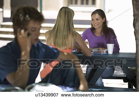 Stock Photo - Two university students having a coffee. Fotosearch