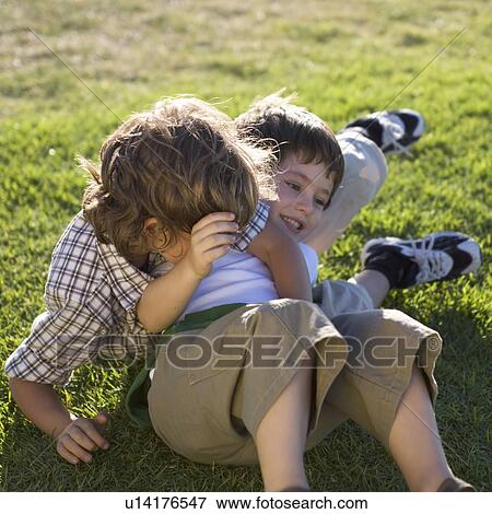 Stock Photo - Two young boys playing. Fotosearch