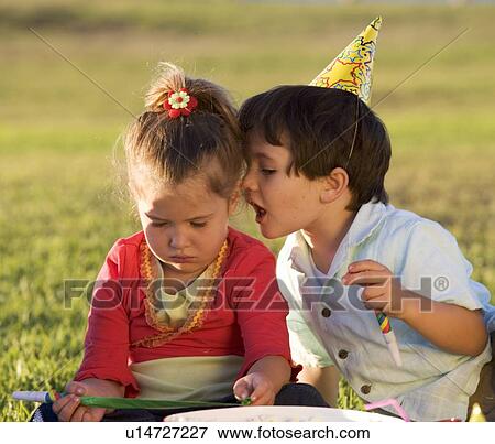 Two young children on a picnic View Large Photo Image Stock Photo - Two young children on a picnic. Fotosearch
