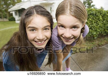 Two young friends View Large Photo Image Stock Image - Two young friends. Fotosearch