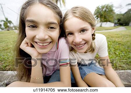Two young friends View Large Photo Image Stock Photography - Two young friends. Fotosearch