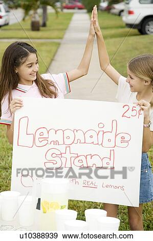 Stock Photo - Two young girls at a lemonade stand. Fotosearch