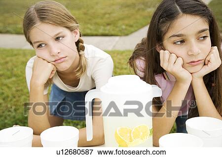 Stock Photo - Two young girls at a lemonade stand. Fotosearch