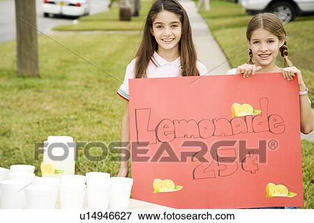 Two young girls at a lemonade stand View Large Photo Image Stock Photo - Two young girls at a lemonade stand. Fotosearch