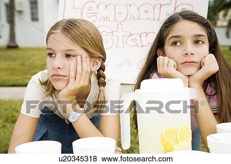 Stock Photo - Two young girls at a lemonade stand. Fotosearch
