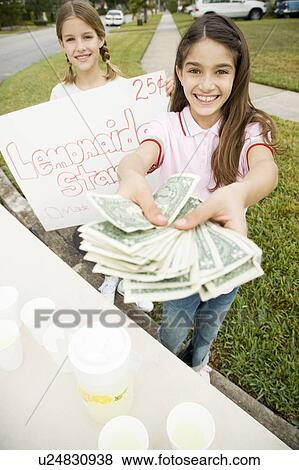 Stock Photo - Two young girls at a lemonade stand. Fotosearch