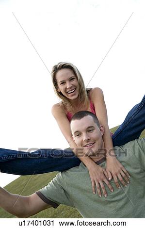 Two young lovers having fun View Large Photo Image Stock Image - Two young lovers having fun. Fotosearch