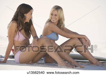 Two young women in bikinis View Large Photo Image Stock Image - Two young women in bikinis. Fotosearch