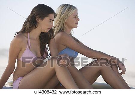 Stock Image - Two young women in bikinis. Fotosearch