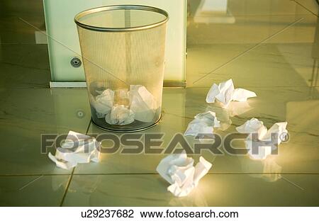 Waste paper scattered around a bin View Large Photo Image Stock Image - Waste paper scattered around a bin. Fotosearch
