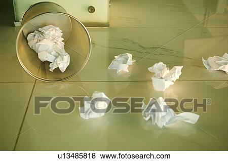 Waste paper scattered around a bin View Large Photo Image Stock Photo - Waste paper scattered around a bin. Fotosearch