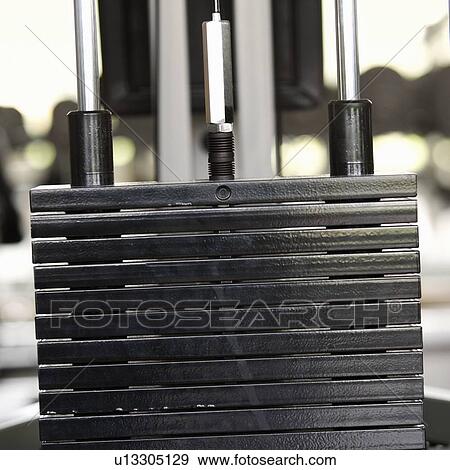 Stock Photo - Weights at a gym, close-up. Fotosearch