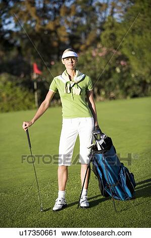 Woman playing golf View Large Photo Image Stock Image - Woman playing golf. Fotosearch