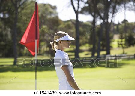 Woman playing golf View Large Photo Image Stock Photo - Woman playing golf. Fotosearch