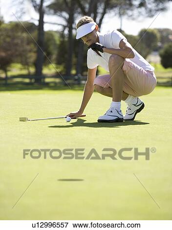 Woman playing golf View Large Photo Image Stock Photo - Woman playing golf. Fotosearch