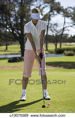Woman playing golf View Large Photo Image Stock Photo - Woman playing golf. Fotosearch