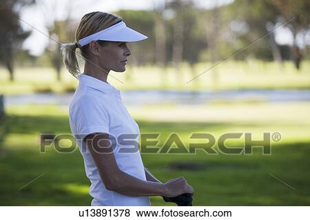 Stock Photo - Woman playing golf. Fotosearch