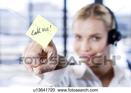 Woman with a call centre headset and a sticky notelet saying Call Me View Large Photo Image Stock Image - Woman with a call centre headset and a sticky notelet saying Call Me. Fotosearch