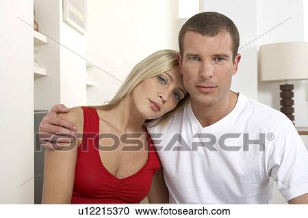 Stock Image - Young couple at home. Fotosearch