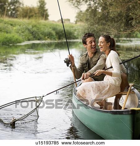 Young couple fishing View Large Photo Image Stock Photography - Young couple fishing . Fotosearch