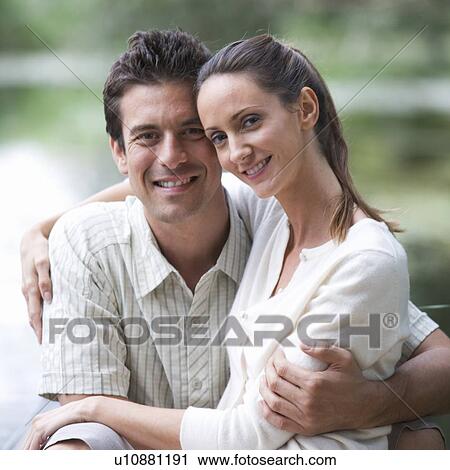 Stock Image - Young couple in a rowing boat. Fotosearch