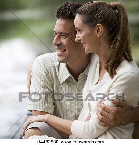 Young couple in a rowing boat View Large Photo Image Stock Image - Young couple in a rowing boat. Fotosearch