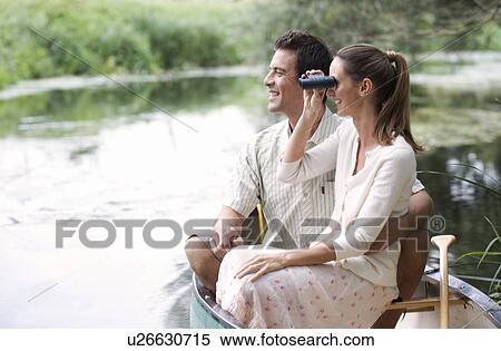 Young couple in a rowing boat View Large Photo Image Stock Photography - Young couple in a rowing boat. Fotosearch