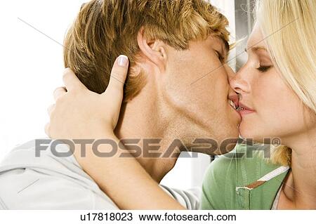 Young couple kissing View Large Photo Image Stock Image - Young couple kissing . Fotosearch