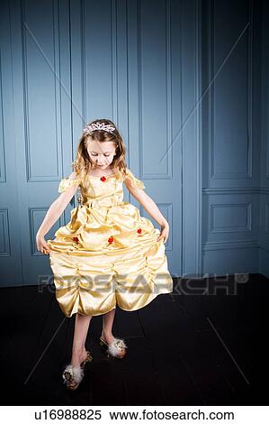 Stock Photography - Young girl in a party dress. Fotosearch