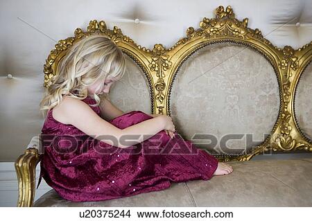 Young girl in a party dress sulking or crying View Large Photo Image Picture - Young girl in a party dress sulking or crying. Fotosearch