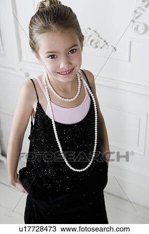 Young girl playing at dressing up View Large Photo Image Stock Image - Young girl playing at dressing up . Fotosearch
