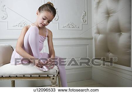 Young girl putting on her ballet shoes View Large Photo Image Stock Image - Young girl putting on her ballet shoes. Fotosearch